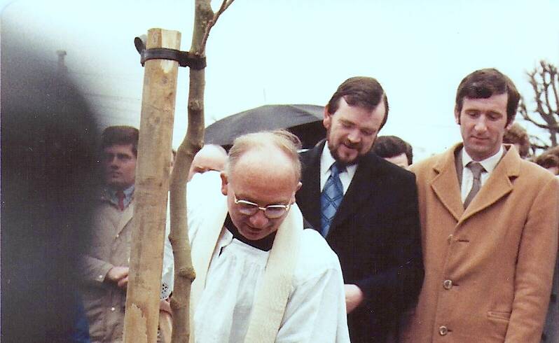 Fr. Ryan plants centenary tree outside clubhouse – 1984